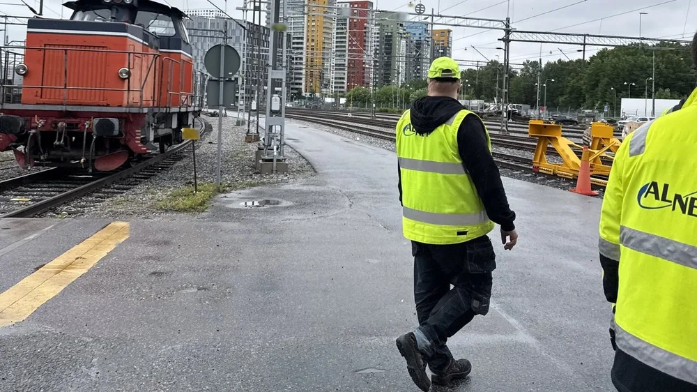 Alnet technicians in a rail yard